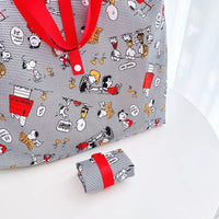 Striped Peanuts character tote bag.