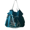 Teal tote bag with white straps.
