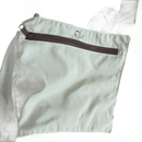 Beige tote bag with zippered pocket.