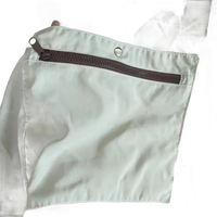 Beige tote bag with zippered pocket.