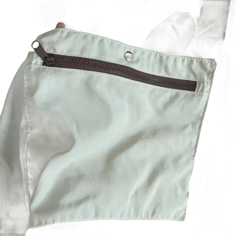 Beige tote bag with zippered pocket.