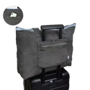 Gray tote bag on luggage.