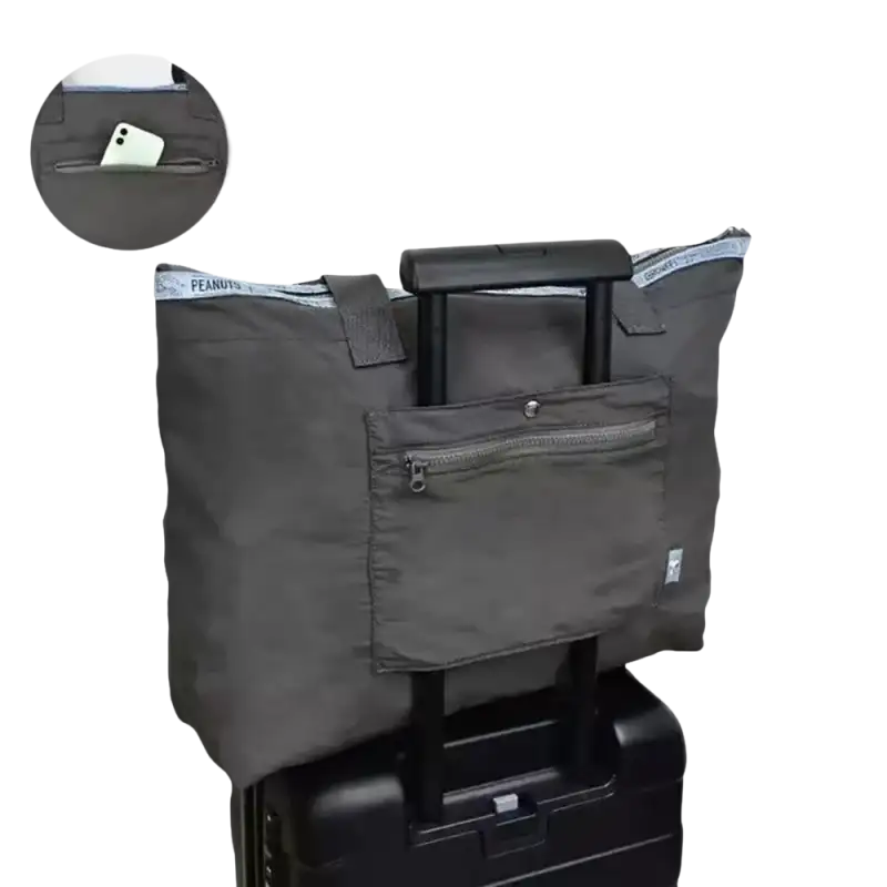 Gray tote bag on luggage.