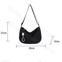 Black shoulder bag with dimensions.