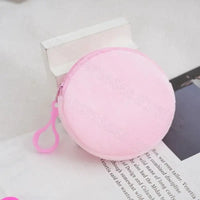 Round pink coin purse with zipper.