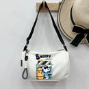 Snoopy-themed white shoulder bag.