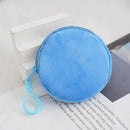 Round, blue, plush coin purse with a zipper and a clip.