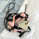 Pink drawstring bucket bag.