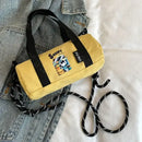 Yellow Snoopy barrel bag.