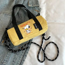 Yellow cylindrical bag with Snoopy design.