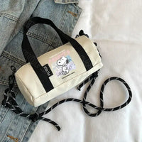 Snoopy-themed barrel bag with black straps.