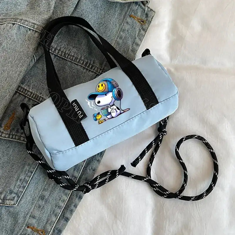 Light blue barrel bag with Snoopy graphic.