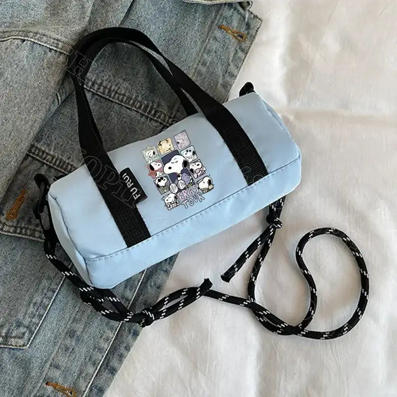 Light blue barrel bag with Snoopy print.