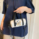White barrel bag with Snoopy design.