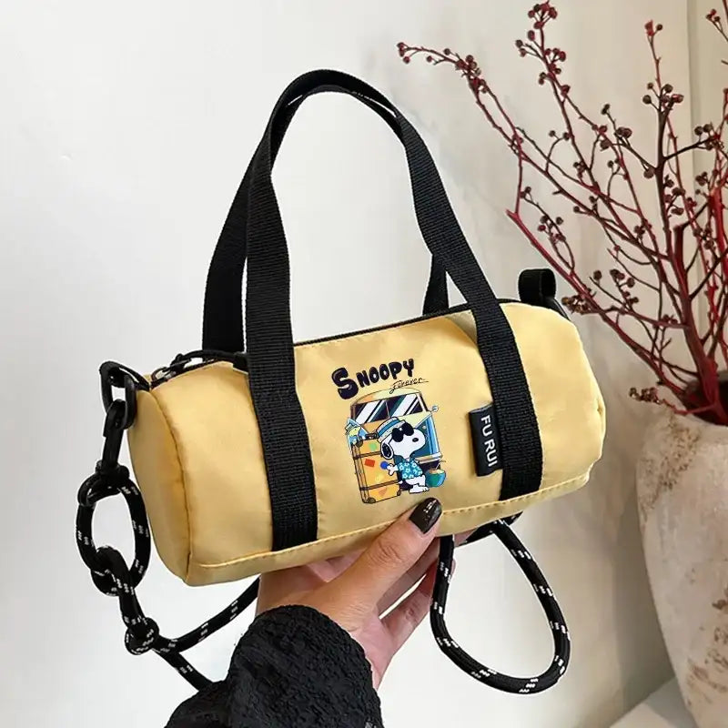 Yellow Snoopy barrel bag.