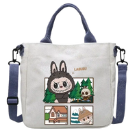 Canvas tote bag with cartoon graphics.