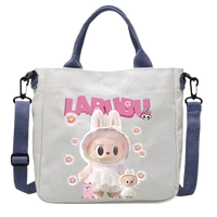 Gray canvas tote bag with bunny graphic.