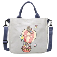 Canvas tote bag with cartoon rabbit design.