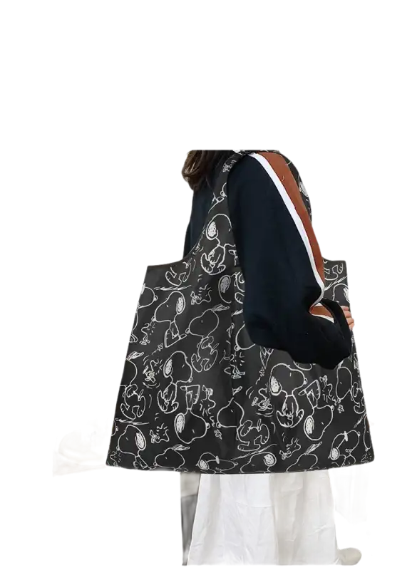 Black tote bag with Snoopy pattern.