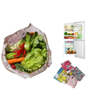 Reusable grocery bag filled with vegetables.