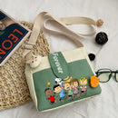 Cartoon-themed canvas shoulder bag.
