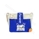 Snoopy-themed shoulder bag with bunny and carrot charms.