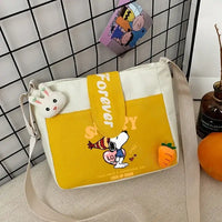 Yellow and white Snoopy shoulder bag.