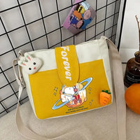 Yellow and white Snoopy messenger bag.
