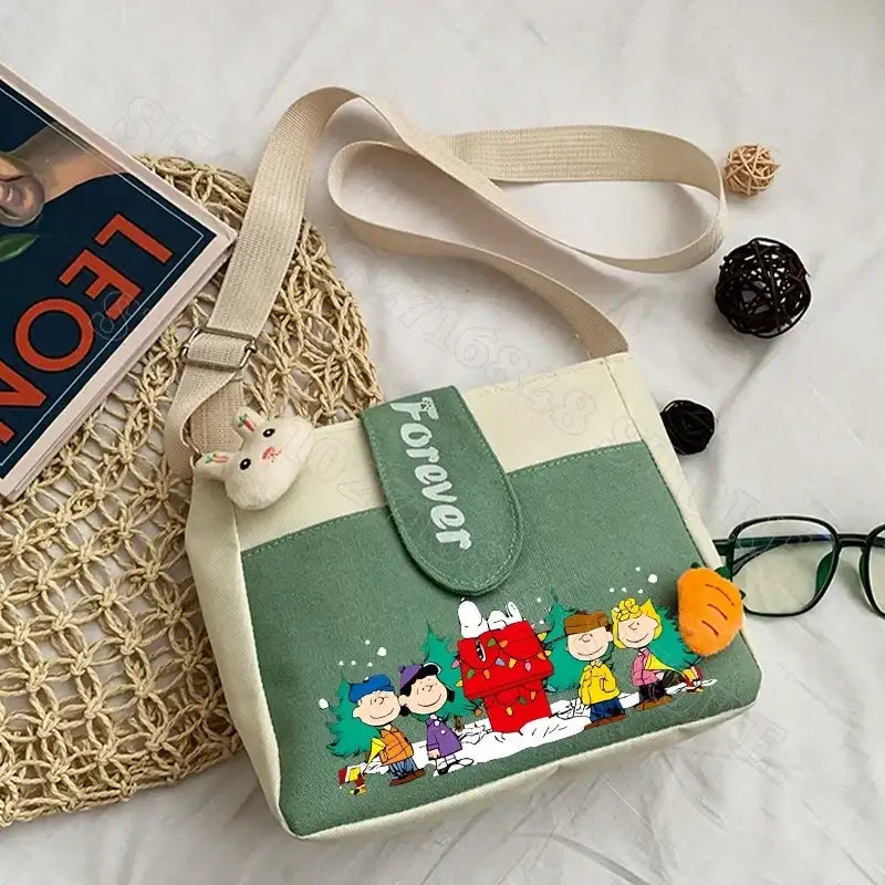 Canvas crossbody bag with cartoon characters.