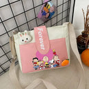 Cartoon-themed pink and white shoulder bag.