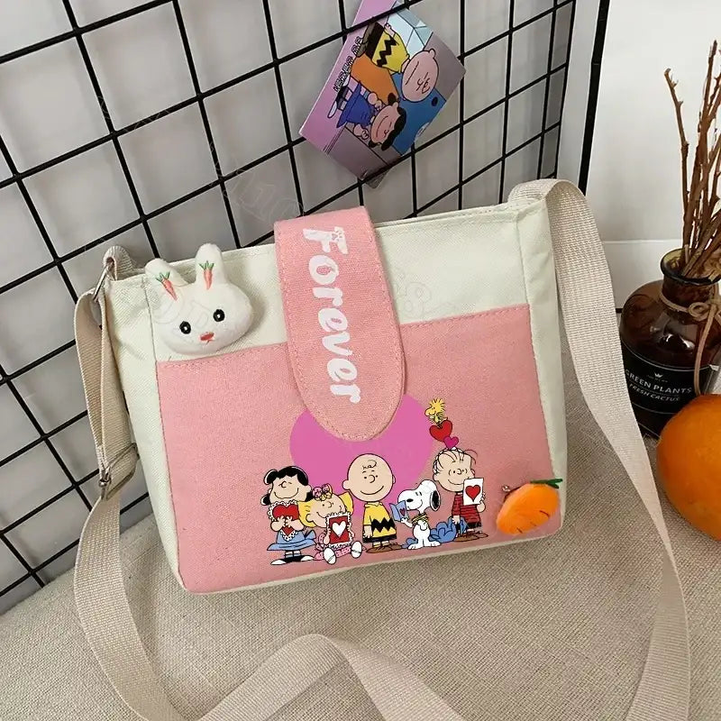 Cartoon-themed pink and white shoulder bag.