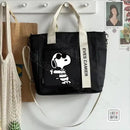 Black tote bag with Snoopy design.