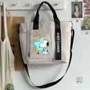Beige tote bag with Snoopy design.