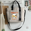 Beige tote bag with Snoopy design.