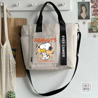 Beige tote bag with Snoopy design.