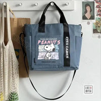 Blue tote bag with Snoopy design.