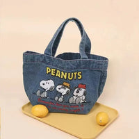 Denim Peanuts character tote bag.