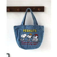 Denim tote bag with Peanuts characters.