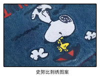 Snoopy embroidery on denim.