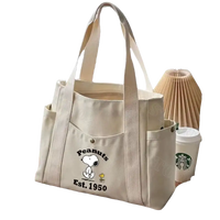 Canvas tote bag with Snoopy design.