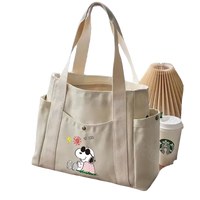 Canvas tote bag with Snoopy design.