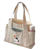 Canvas tote bag with Snoopy design.