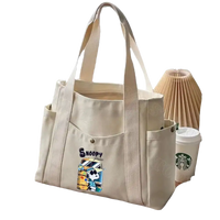 Canvas tote bag with Snoopy design.
