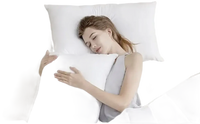 Sleeping woman hugging a pillow.