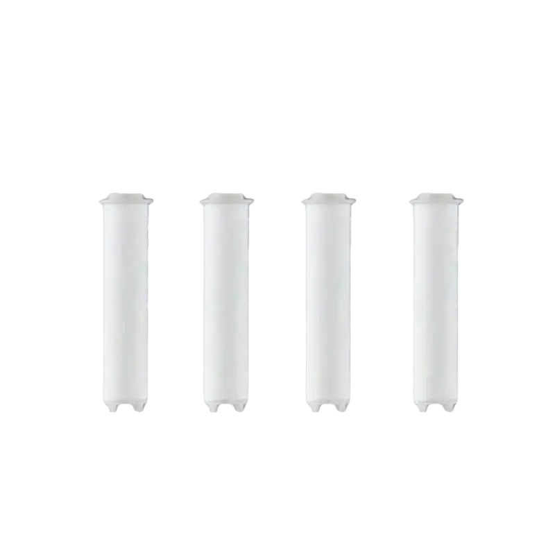 Four white shower filter cartridges.