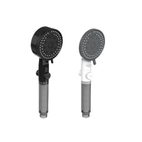 Two handheld shower heads with dimensions.