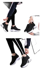 Black athletic shoes with white soles.