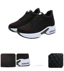 Black athletic shoes with white soles.