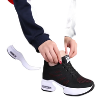 Black and red athletic shoe with white sole.
