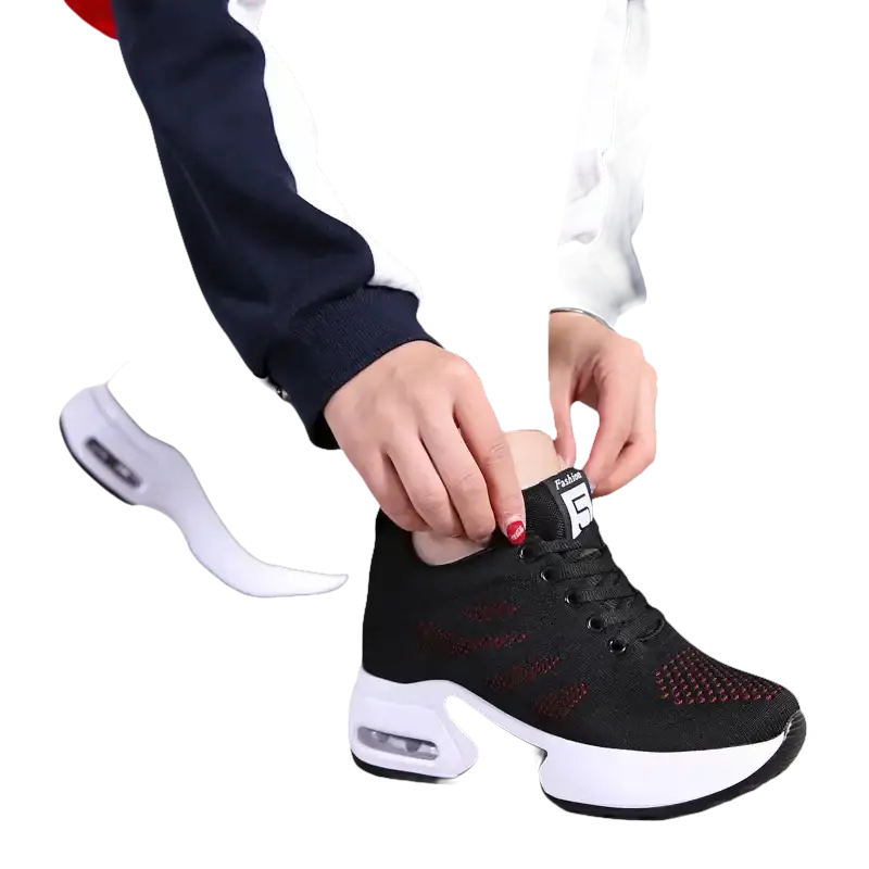 Black and red athletic shoe with white sole.